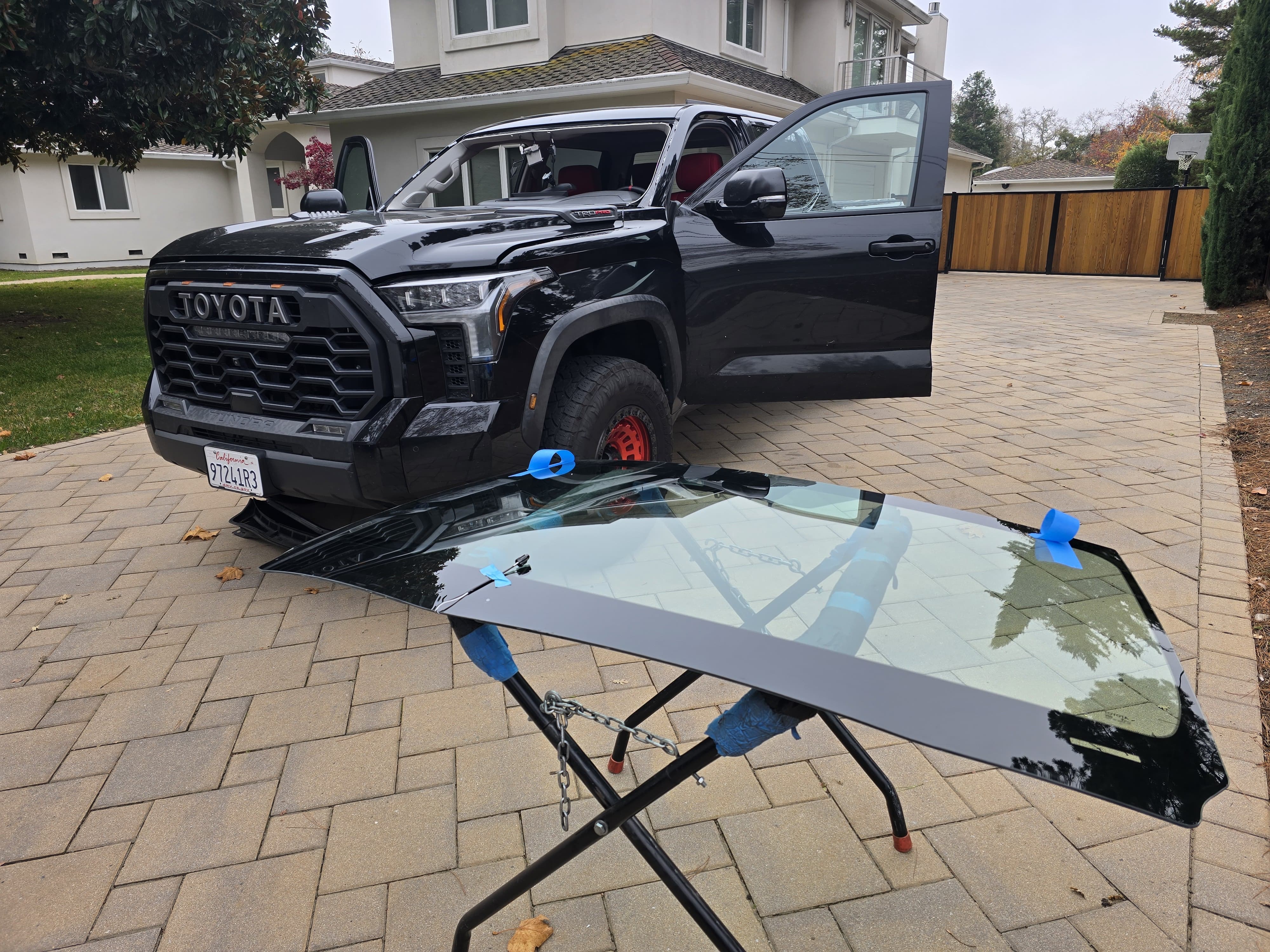 Black Toyota Tundra TRD Pro with windshield removed during mobile windshield replacement service by East Valley Auto Glass